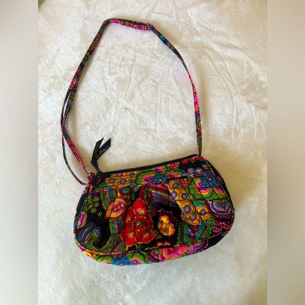 Zip closure.
9.0" w x 6.25" h x 2.5" d,  7.0" strap drop, 56.0" , adjustable